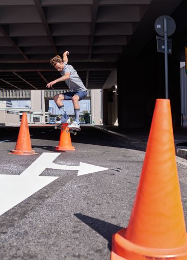 City, trick and man with skateboard, jump and skills for...