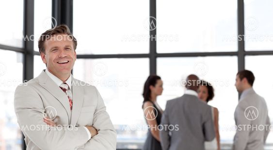 Joyful male manager leading his team