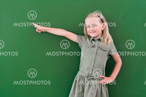 schoolgirl portrait near the blackboards