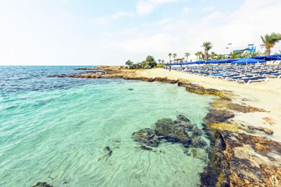 Daylight view to Nissi Beach with colorful bright blue...