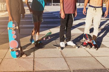 Training, legs and group with skateboard, sports and...