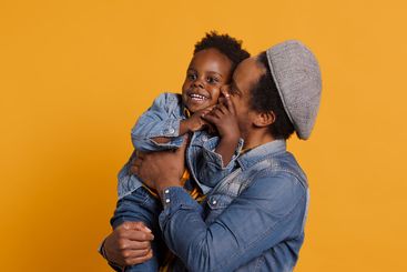 African american father and cute toddler having fun...