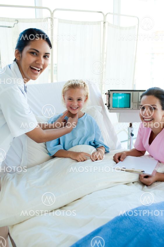 Female Doctor and nurse examining a patient