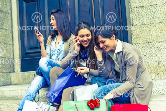 Group of Women Talking on Mobile Phone