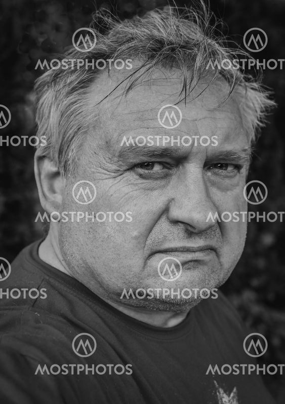 Old thoughtful man in park
