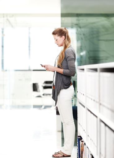 Business, smartphone and woman in office, profile and...