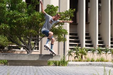 City, jump and man with skateboard, skills and...