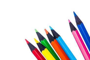 Colorful collection of pencils arranged in a row on...