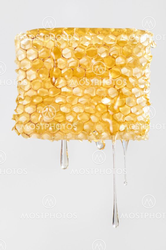 Honey dripping from honeycomb