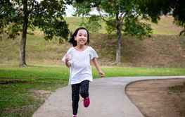 Asian Little Chinese Girl running happily