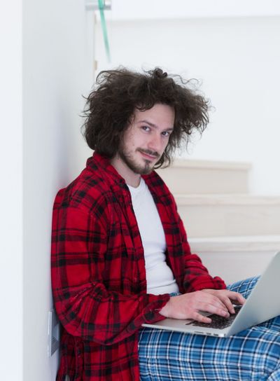 freelancer in bathrobe working from home