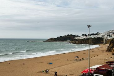 Sandy beach and seaside in Albufeira, Portugal, with...