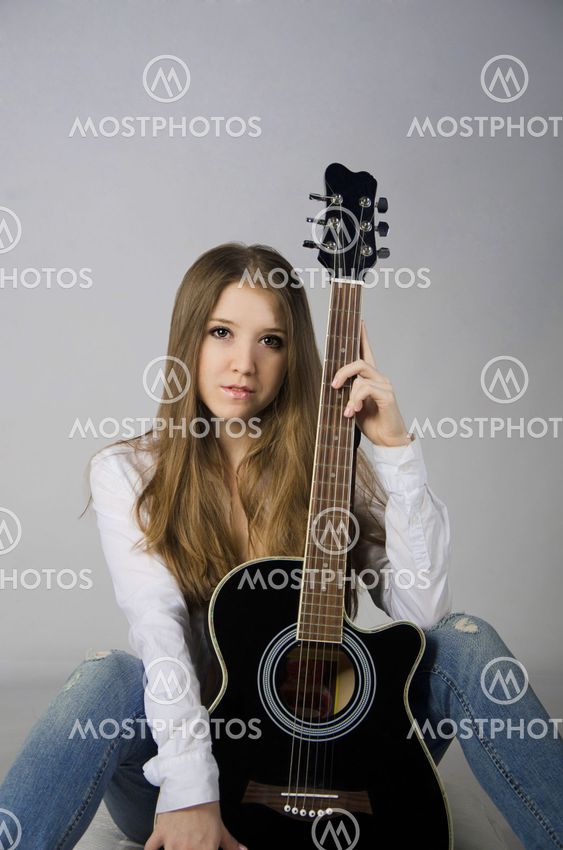 Beautiful girl with a guitar