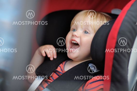 Boy sitting in car seat