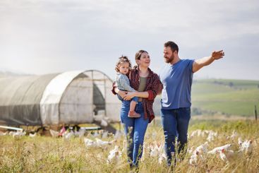 Farming, parents and girl with chickens, walking or...