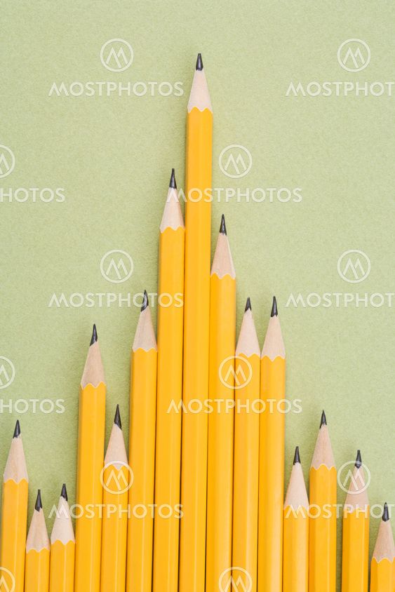 Pencils in uneven row.