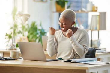 Business, laptop and black woman in office, celebration...