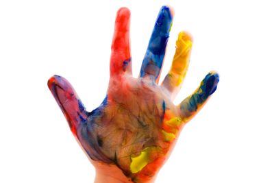 Childrens hand in the paint close up
