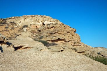 Coastal cliff at sunset.