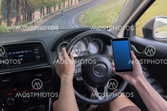 man driving a car and use mobile tablet for check the map