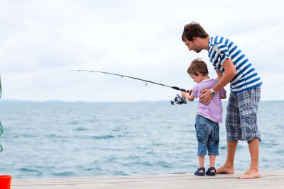 Father and son fishing together