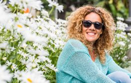 Cheerful portrait of young woman smiling at the camera...