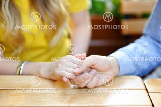 Young couple holding hands
