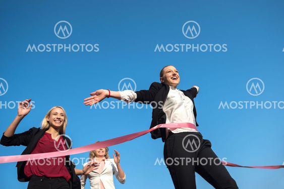business people running on racing track