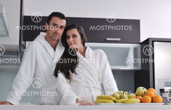 young couple have fun in modern kitchen