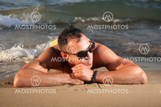 young man relaxing on the beach