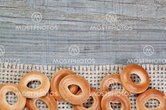 Christmas bagels on sackcloth texture wood.
