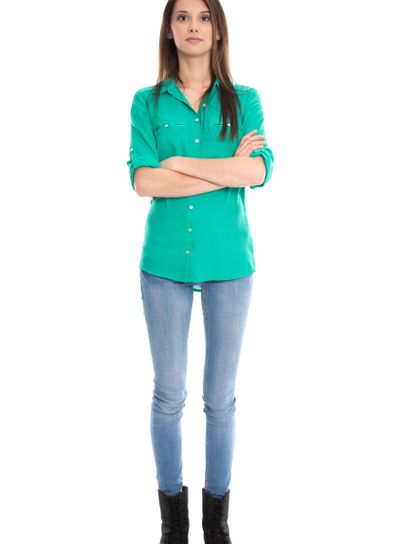Isolated young woman in blue jeans in full length.