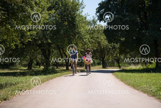Young multiethnic couple having a bike ride in nature