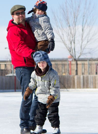 Happy family at the skating rink