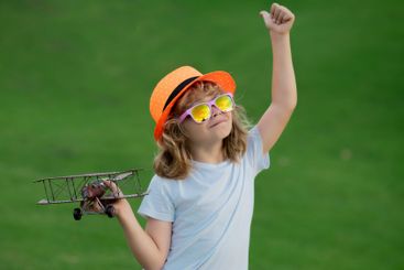 Childhood dream imagination concept. Portrait of child...