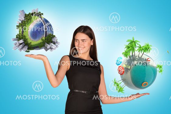 Businesswoman holding two earth globes