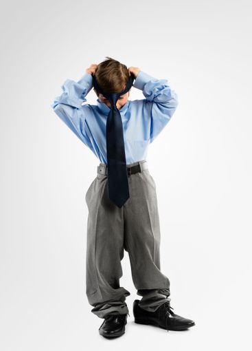 Child, boy and business clothes in studio for childhood...