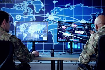 Cyber Technology Expert Monitors Security Cameras In...