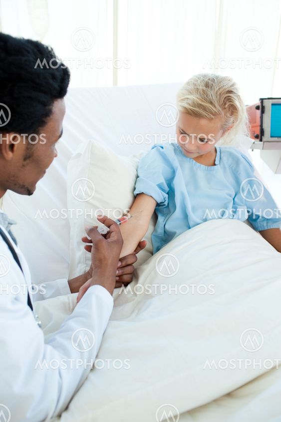Attractive doctor giving a patient an injection