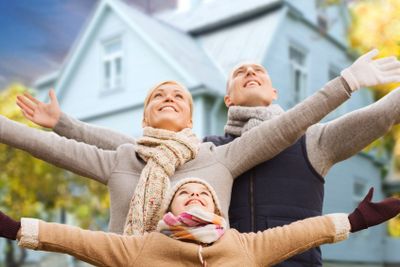 happy family over living house in autumn