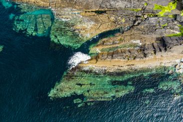 Aerial view of rough rocky shore along famous Ring of...