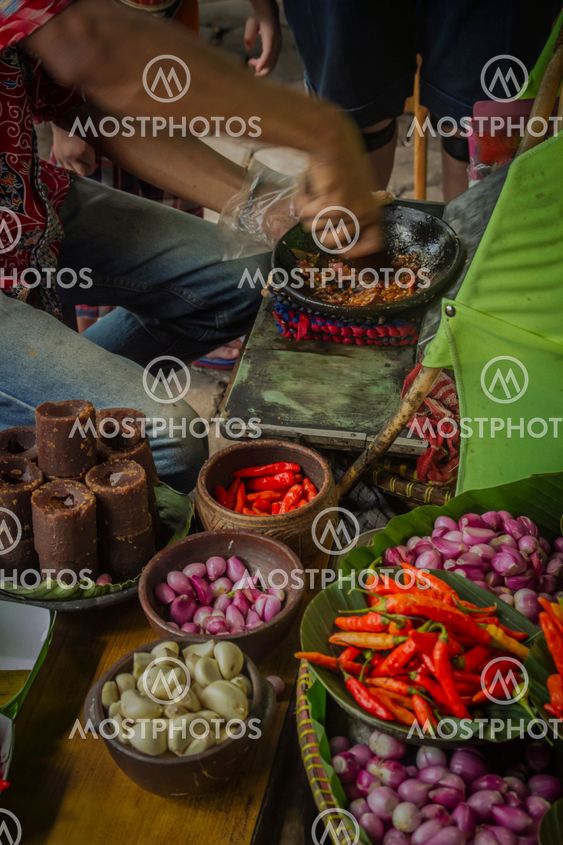The seller is making special sambal for traditional fried...