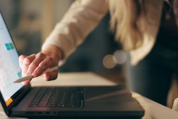 Laptop, screen and business people together at night for...