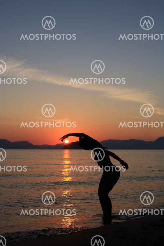 silhouette of a dancer in the beach