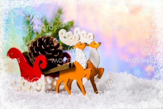 composition of Christmas decoration reindeer and Santa sleigh with branch fir tree, pinecones in snow on northern light background, closeup