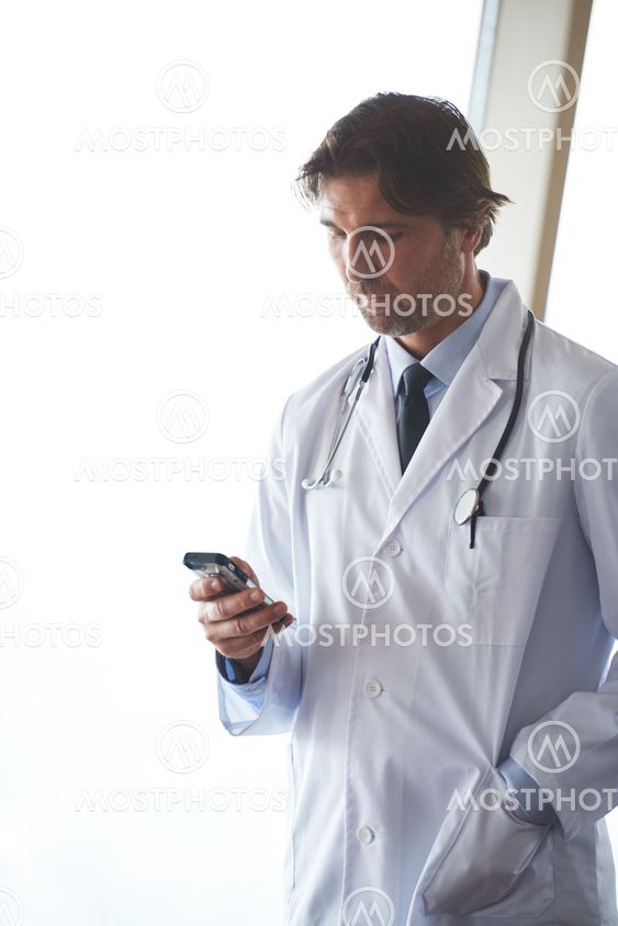 doctor speaking on cellphone