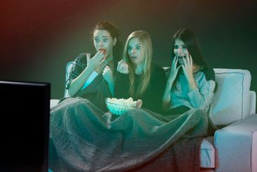 Scared teenage girls  watching movies