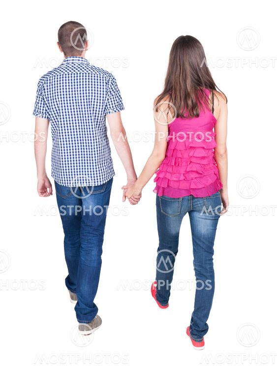 Back view of going young couple