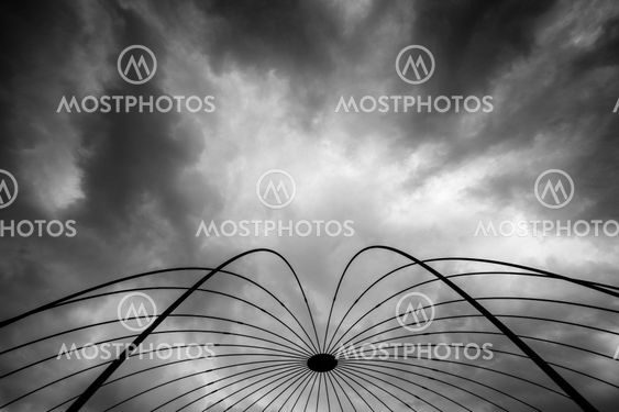 Abstract space lines against dramatic sky.