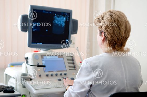 medical doctor during ultrasound investigation